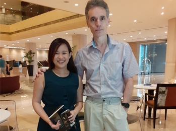 Juan Estadella with the astrologer May Sim in Singapore (Singapore), 2022. 